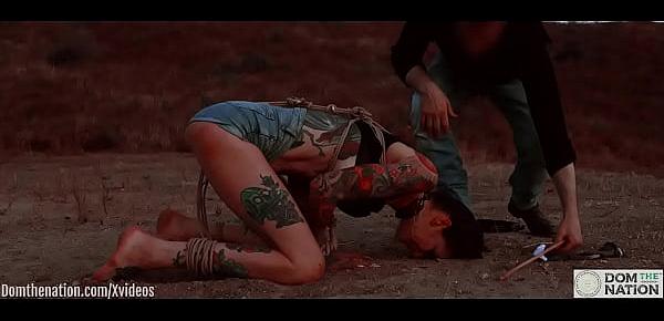  Ass eating bondage slave cries while her feet get caned outdoors in the dirt - Rocky Emerson